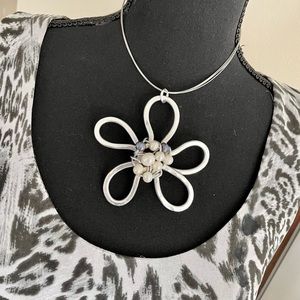 Artisan silver necklace with white and black pearls set in abstract flower